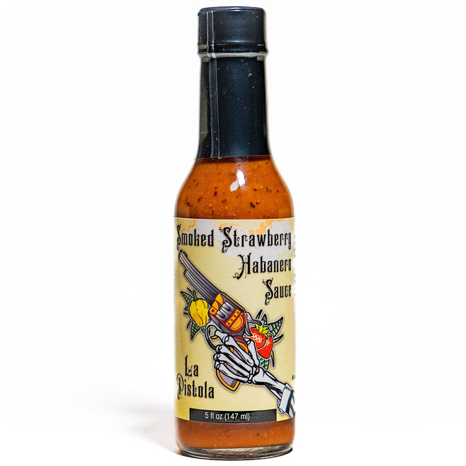 Bottle of La Pistola Smoked Strawberry Habanero Sauce on a white background