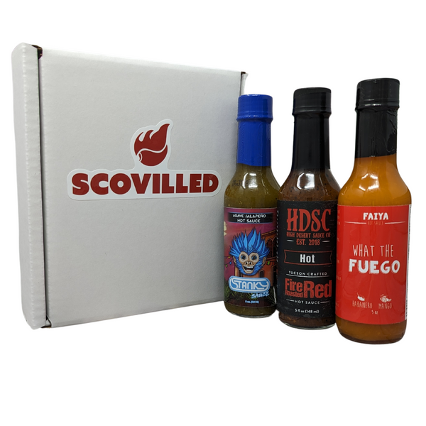SCOVILLED subscription box with Stanky Sauce Agave Jalapeno, High Desert Fire Roasted Red and What The Fuego bottles