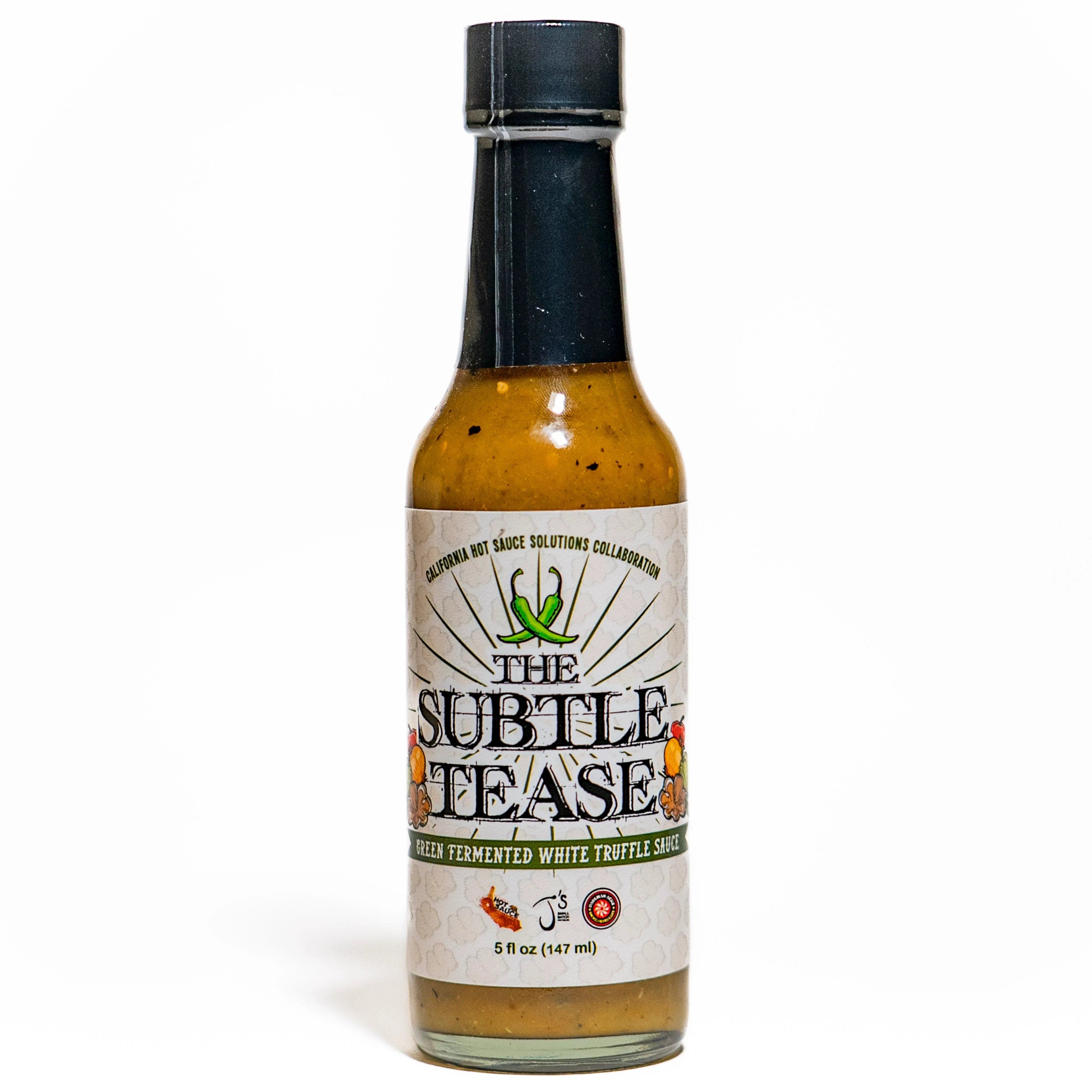 Bottle of 'The Subtle Tease' white truffle sauce on a white background